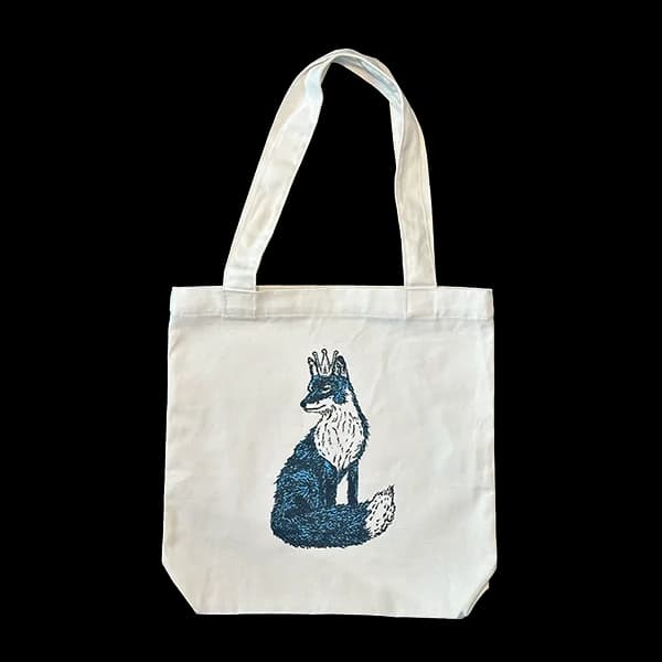 Natural canvas tote bag printed with a crowned fox in deep blue